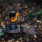 Profile view of combo set in use -- damp wood used as wood stove fuel